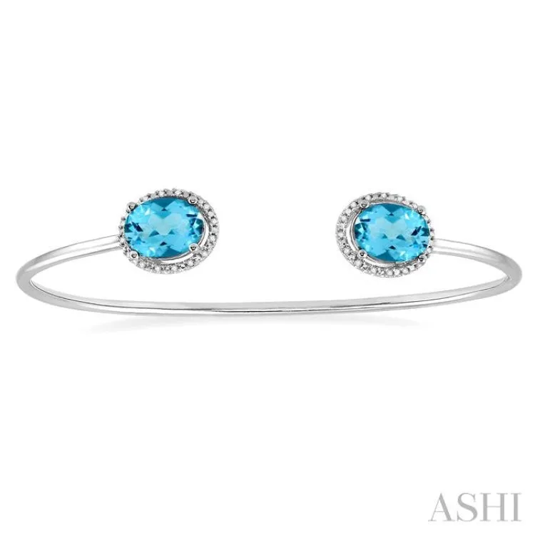 1/10 Ctw Oval Shape 9x7mm Blue Topaz & Round Cut Diamond Bangle in Sterling Silver