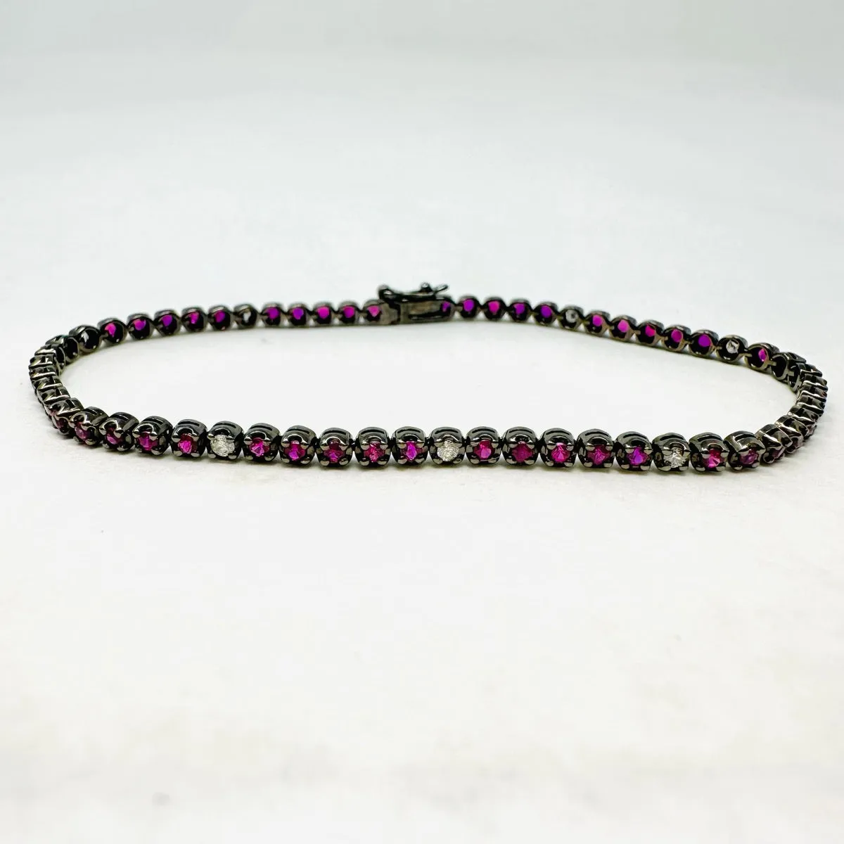 18K White Gold Tennis Bracelet with 51 Rubies and 10 Diamonds