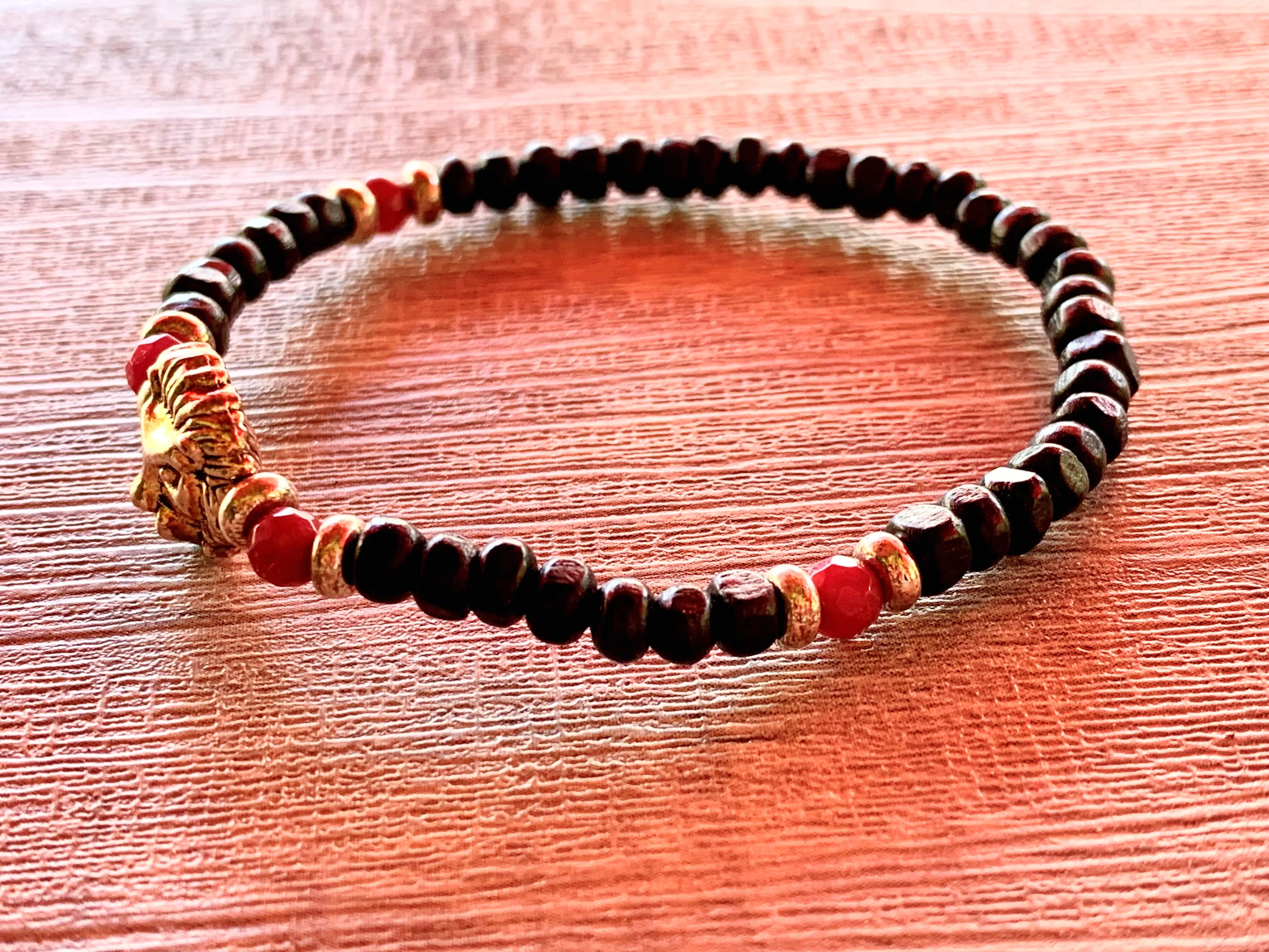 Leo Handmade Ruby, Gold Plated Hematite, and White Lava Or Black Wood Beaded Expandable Bracelet with Lion Charm