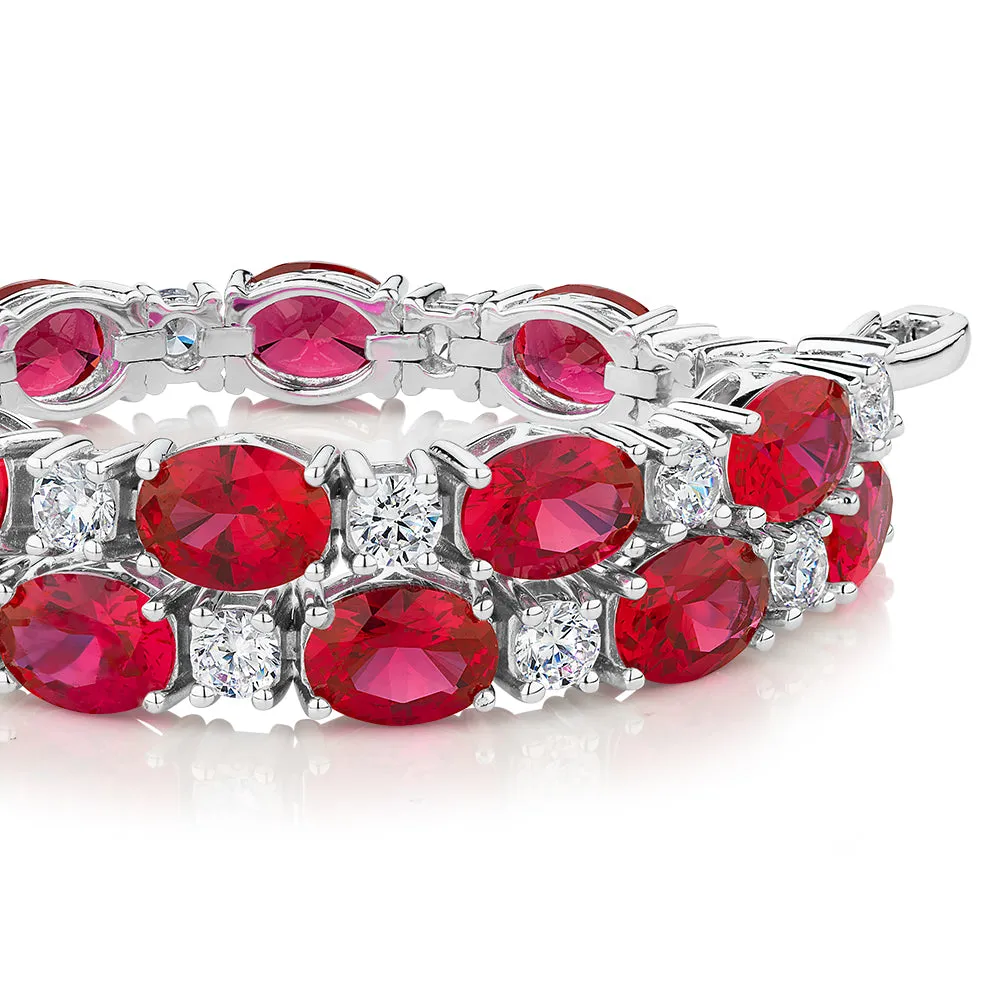 Round Brilliant tennis bracelet with ruby simulants and 3.36 carats* of diamond simulants in sterling silver