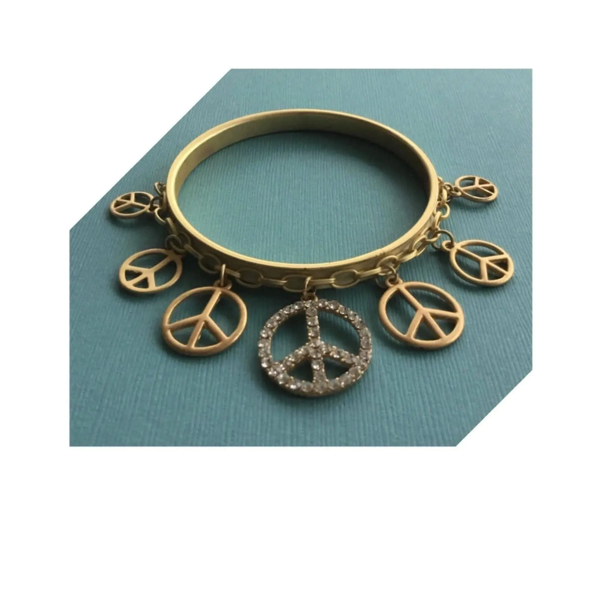 Truly eye-catching vintage stack bangles dangle peace charms